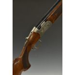 Beretta Ultra Light 12 bore over and under ejector shotgun with engraved scenes of birds to the