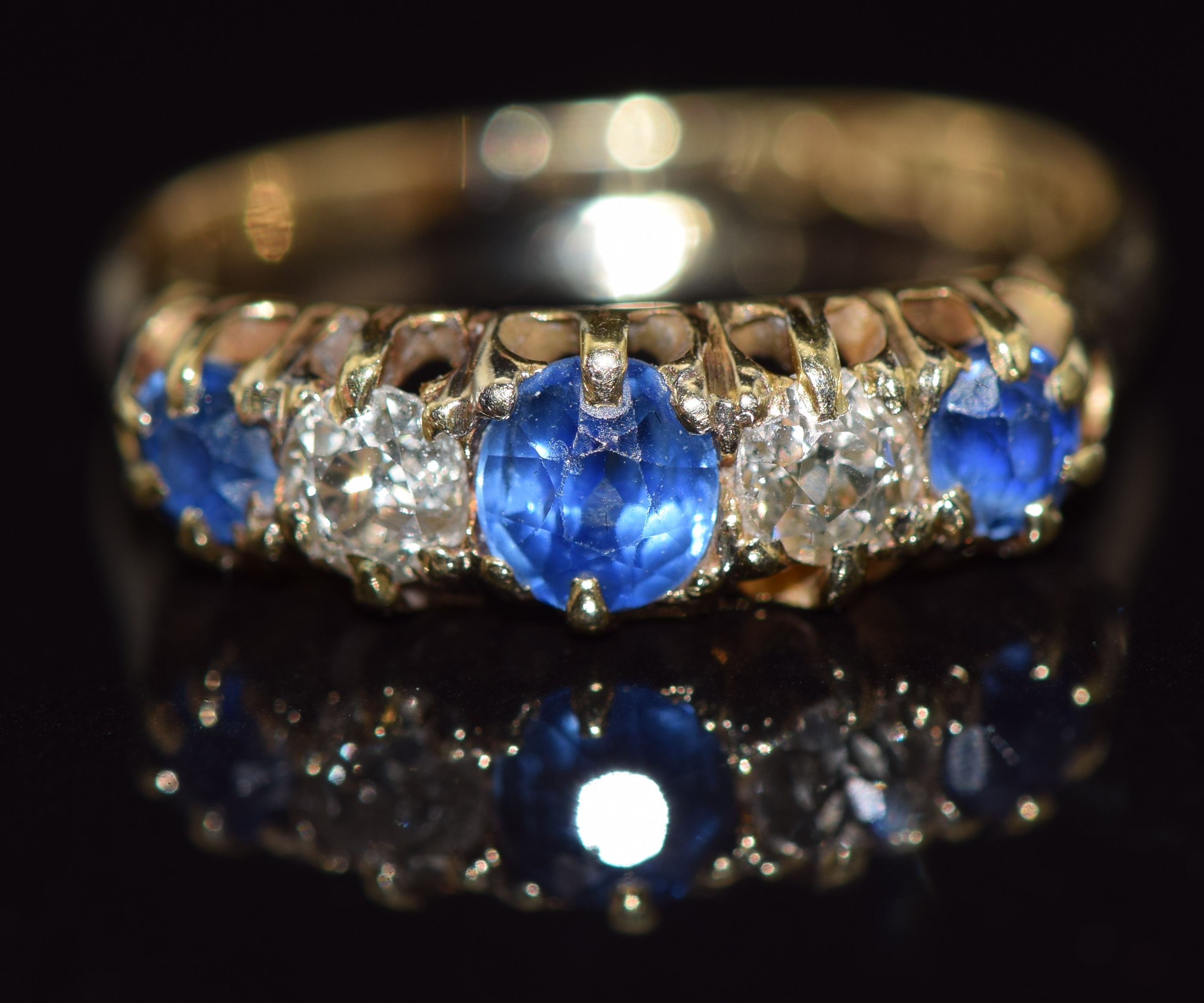 Victorian 18ct gold ring set with old cut sapphires and diamonds, total diamond weight approximately