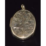 A 9ct gold locket with engraved decoration, 11.9g