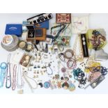 A collection of costume jewellery including beads, Sphinx brooch, silver ring, etc
