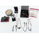 A collection of silver jewellery including a suite of jewellery set with ivory, bangles,