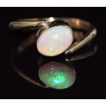 A 9ct gold ring set with an oval opal cabochon, 2.3g, size H