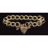 A 9ct gold bracelet made up of double oval links with heart padlock, 16.4g