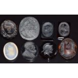 Eight smoky quartz, glass and similar carved cameos and intaglios, all depicting classical figures