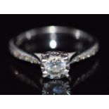 A 9ct white gold ring set with diamonds totalling approximately 0.4ct, size K, 2.6g