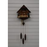 Large three train Black Forest cuckoo clock with musical dancer feature, waterwheel and woodman