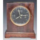 A mahogany cased military style mantel clock with stop/start, black dial, white hands and makers and