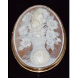 A 14k gold brooch set with a cameo depicting a vase of flowers, signed C.Noto, 6.3 x 4.7cm