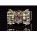 Art Deco ring set with rose cut diamonds in a stylised bow setting, the central diamond