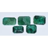 Five loose emerald cut emeralds, total 5.5ct