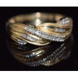 A 14k gold ring set with diamonds in a twist setting, 2.2g, size P