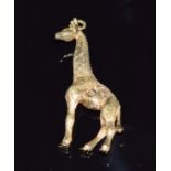 Franz Hirner 18ct gold pendant in the form of a giraffe set with two diamonds, 4 x 1.5cm, 13g