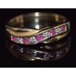 A 9ct gold ring set with diamonds and rubies in a twist setting, 2.8g, size O