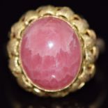 A yellow metal ring set with rhodochrosite cabochon, 5.4g, size P/Q