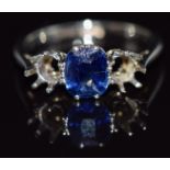 An 18ct white gold ring set with a cushion cut sapphire of approximately 0.75cts in a platinum