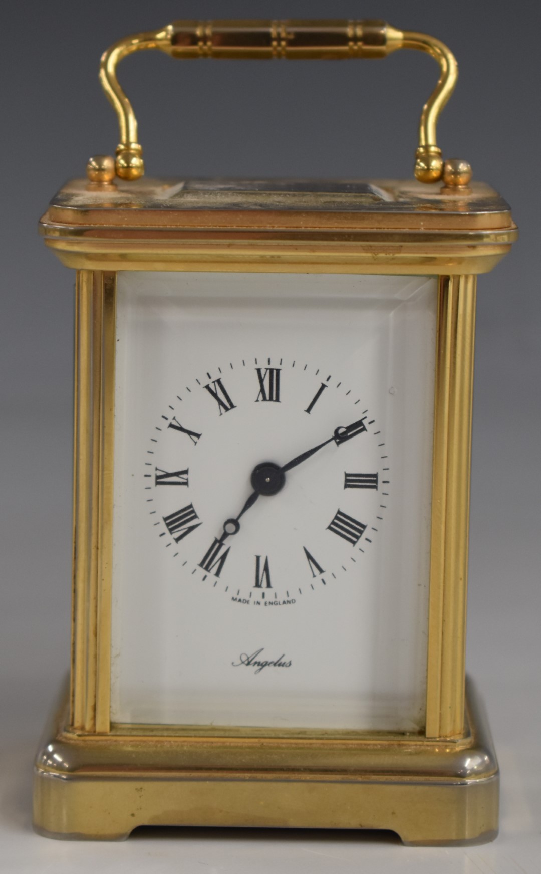 Angelus miniature brass carriage clock with enamelled Roman dial and Breguet style hands, 7.5cm