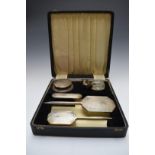 Cased Art Deco hallmarked silver mounted dressing table set comprising hand mirror, two brushes