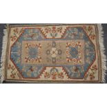 A rug with banded elim and fringed ends, 132 x 83cm