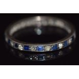 A c1920 eternity ring set with alternating sapphires and diamonds, 1.1g, size K