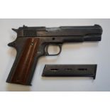 BBM Bruni 96 Automatic 8mm blank firing pistol with wooden grips and a spare magazine.