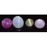 Two pink star sapphires, a blue star sapphire and a chatoyant green sapphire, 1.7g