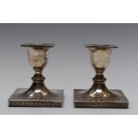 Pair of Walker and Hall Art Deco hallmarked silver squat, square candlesticks with Greek key
