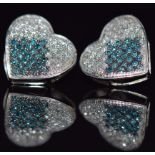 A pair of 10k white gold earrings in the form of hearts, set with blue and clear diamonds, 1.8g