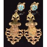 A pair of yellow metal earrings set with enamel and with embossed floral decoration, 4.6g