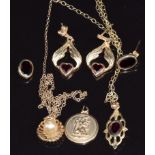 Two 9ct gold necklaces, 9ct gold St Christopher and a pair of earrings set with garnets, 7.7g