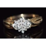 A 9ct gold ring set with diamonds in a cluster, total diamond weight approximately 0.25ct, 3.6g,