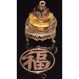 Chinese 14k gold pendant in the form of a Chinese character (1g) and a 9ct gold pendant set with a