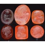 Five agate carved intaglios, largest 3 x 2cm and a glass intaglio