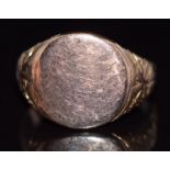 A 9ct rose gold signet ring with engraved shoulders, 5.6g, size J