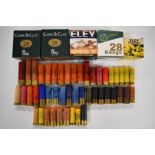 A collection of 28, 12 bore and .410 shotgun cartridges together with various primed empty cases,