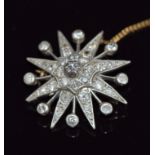 A c1900 star brooch set with diamonds in gold and white metal setting, 6.2g, 2.8cm