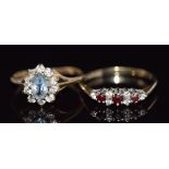 Two 9ct gold rings, one set with garnets the other topaz, 3.1g, sizes N and M