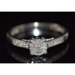 A 9ct white gold ring set with diamonds, 1.9g, size K