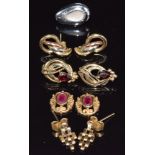 Three pairs of 9ct gold earrings, two sections of earrings set with a ruby to each (5.3g), and an