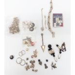 A collection of silver including earrings, bracelet, St Christopher charms, etc