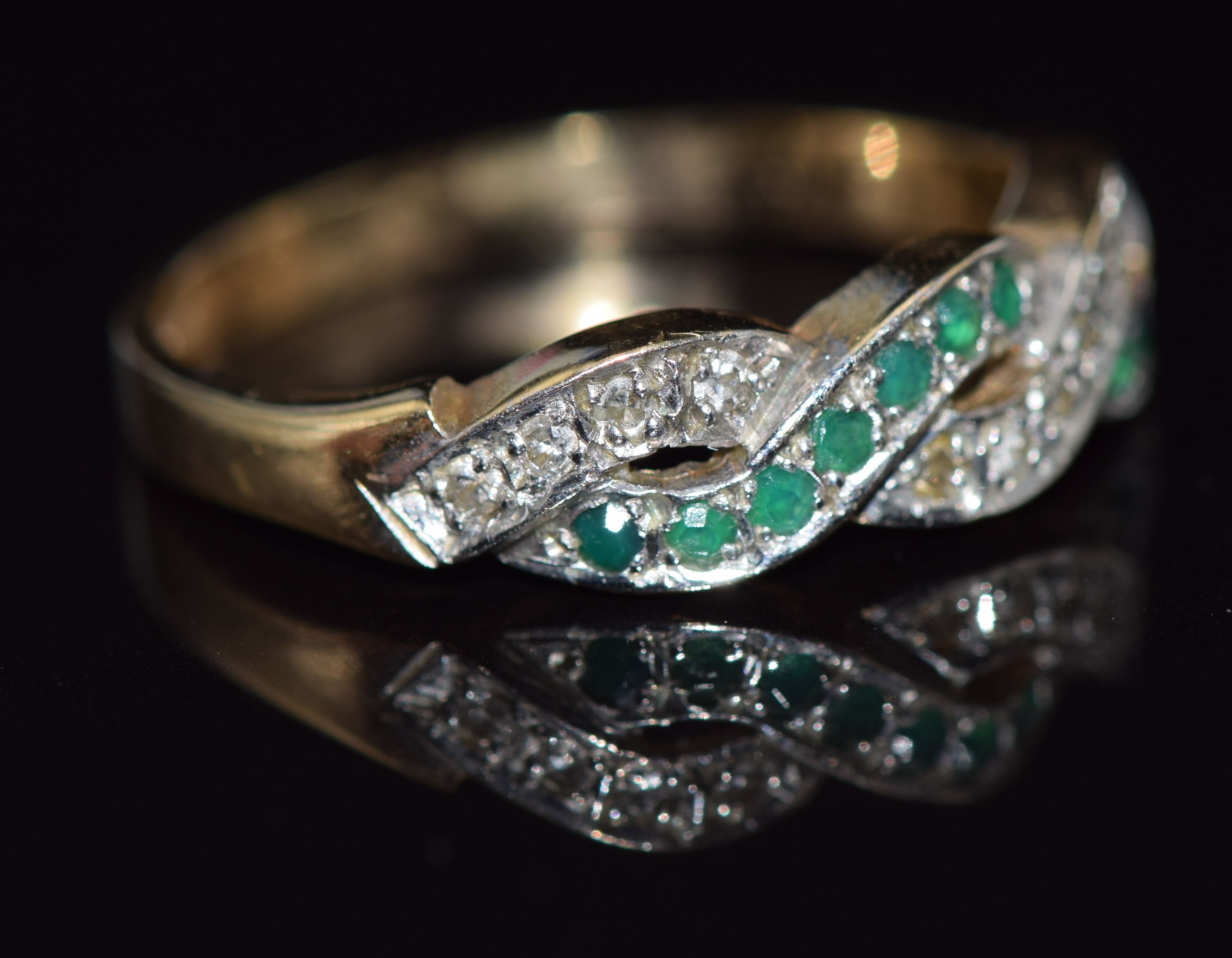 A 9ct gold ring set with emeralds and diamonds in a twist setting, 2.6g, size P - Image 2 of 2