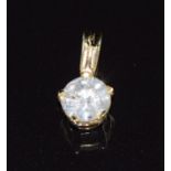 An 18ct gold pendant set with a round cut diamond of approximately 0.48ct, with certificate