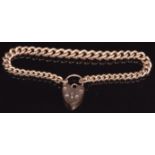 A 9ct rose gold curb link bracelet with heart padlock, 20g