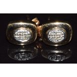 A pair of 9ct gold earrings set with diamonds, 2.1g