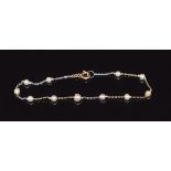A 9ct gold bi-coloured bracelet set with pearls