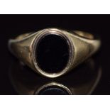 A 9ct gold signet ring set with onyx, 5.7g, size P