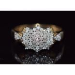 A 9ct gold ring set with diamonds in a cluster, total diamond weight approximately 0.5ct, 3.1g, size