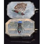 A pair of silver brooches set with a variety of agate, one depicting a fly the other a butterfly,