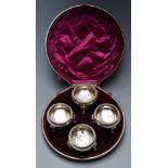 A 19thC cased set of four silver plated footed salts, diameter of case 19cm