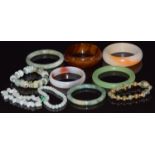 Three beaded jadeite bracelets, two jadeite bangles and three agate bangles