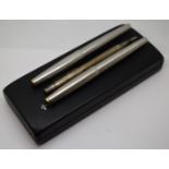 Two Parker 61 fountain pens with brushed stainless steel bodies and a hallmarked silver Yard-O-Led